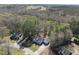 Picturesque aerial view of a home nestled among mature trees at 1012 Mountain Laurel Dr, Raleigh, NC 27603