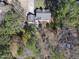 An aerial shot looking straight down onto a home surrounded by trees and shadows at 1012 Mountain Laurel Dr, Raleigh, NC 27603