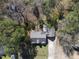 A straight down view shows a home with a large backyard and a deck, surrounded by trees at 1012 Mountain Laurel Dr, Raleigh, NC 27603