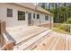 A wooden back deck with stairs leading down to the yard, perfect for outdoor relaxation and entertaining at 1012 Mountain Laurel Dr, Raleigh, NC 27603
