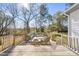 Staged backyard deck with plenty of lounge seating and natural views of the yard at 1012 Mountain Laurel Dr, Raleigh, NC 27603