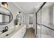 Bright bathroom features double sinks, modern fixtures, and a glass-enclosed shower at 1012 Mountain Laurel Dr, Raleigh, NC 27603