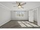 A serene bedroom showcases plush carpet, natural light through the window, and a ceiling fan at 1012 Mountain Laurel Dr, Raleigh, NC 27603