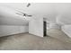 Expansive bonus room with plush carpet and neutral walls, bathed in natural light at 1012 Mountain Laurel Dr, Raleigh, NC 27603