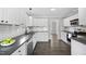 Modern kitchen with sleek countertops, subway tile backsplash, and contemporary appliances, making it a chef's dream at 1012 Mountain Laurel Dr, Raleigh, NC 27603