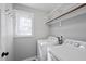 Functional laundry room with white washer and dryer, offering convenience and efficiency at 1012 Mountain Laurel Dr, Raleigh, NC 27603