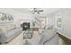 Bright living room with fireplace, neutral color palette, and large windows offering natural light at 1012 Mountain Laurel Dr, Raleigh, NC 27603