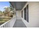 This home features a cozy front porch with painted wood and views of the surrounding neighborhood at 1012 Mountain Laurel Dr, Raleigh, NC 27603