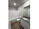 Well-lit bathroom features a granite countertop, white cabinets, and a shower-tub combination for convenience at 108 Faucette Dr, Selma, NC 27576