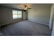 Spacious bedroom featuring modern fan, plush carpet flooring, and ample natural light at 108 Faucette Dr, Selma, NC 27576