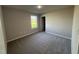 A well-lit bedroom featuring neutral walls and plush carpeting for ultimate comfort and a cozy feel at 108 Faucette Dr, Selma, NC 27576