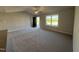 Cozy living room showcasing plush carpet flooring and a window providing plenty of natural light at 108 Faucette Dr, Selma, NC 27576