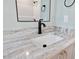 Bathroom vanity with granite countertops and black faucet at 110 Purslane Dr, Franklinton, NC 27525