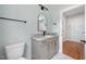 Bathroom featuring a gray vanity with stone countertop and modern fixtures at 110 Purslane Dr, Franklinton, NC 27525