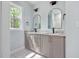 Bathroom featuring double sinks, gray cabinets, stylish fixtures, and marble countertops at 110 Purslane Dr, Franklinton, NC 27525
