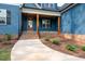 Close up of home's covered porch and front door with brick base and wood supports at 110 Purslane Dr, Franklinton, NC 27525