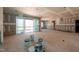 Open-concept living area, unfinished, with sliding doors to an outdoor porch and lots of natural light at 110 Purslane Dr, Franklinton, NC 27525