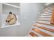 Modern staircase with hardwood treads and decorative niche at 110 Purslane Dr, Franklinton, NC 27525