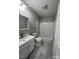Bathroom with combination shower and tub with white vanity and a single sink at 1111 Lancaster St, Durham, NC 27701