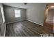Bright room with luxury vinyl flooring, and a window which provides natural light and outside views at 1111 Lancaster St, Durham, NC 27701