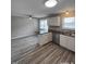 Modern kitchen boasting stainless steel appliances and sleek countertops overlooking a spacious dining area at 1111 Lancaster St, Durham, NC 27701