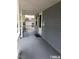 Inviting covered porch with painted floors and walls that add to the home's curb appeal at 1111 Lancaster St, Durham, NC 27701
