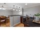 Wet bar with custom lighting, granite counters, tile backsplash, and built-in cooler at 113 Kings Castle Dr, Apex, NC 27502