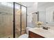 Modern bathroom featuring glass-enclosed tile shower, vanity with sink, and new fixtures at 113 Kings Castle Dr, Apex, NC 27502