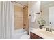 This bathroom features a shower and tub with stone tile and decorative elements, plus a stylish dark wood vanity at 113 Kings Castle Dr, Apex, NC 27502