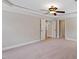 Spacious bedroom featuring plush carpeting, neutral paint, and ample closet space with many doors at 113 Kings Castle Dr, Apex, NC 27502