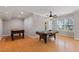 Bright game room with multiple game tables, hardwood floors, and natural lighting at 113 Kings Castle Dr, Apex, NC 27502