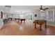 Large game room offering many activities, windows, and hardwood floors at 113 Kings Castle Dr, Apex, NC 27502