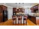 Kitchen with granite countertops, stainless steel appliances, and a breakfast bar at 113 Kings Castle Dr, Apex, NC 27502