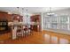 Kitchen with breakfast bar, granite countertops, and hardwood floors and dining area at 113 Kings Castle Dr, Apex, NC 27502