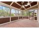 Inviting sunroom with wood ceiling, skylights, and screened windows, offering a tranquil space to relax at 113 Kings Castle Dr, Apex, NC 27502
