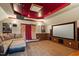 Enjoy movies in this carpeted home theater with projector, large screen, and comfortable seating at 113 Kings Castle Dr, Apex, NC 27502