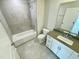 Bathroom featuring tiled shower/tub combination and vanity with a gray countertop at 1200 Alston Landing Way # 05, Cary, NC 27519