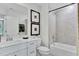 Bathroom featuring a shower-tub combo, vanity with modern fixtures, and decorative artwork, combining style and practicality at 1200 Alston Landing Way # 05, Cary, NC 27519