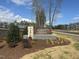 Well maintained community sign for Alston Landing is surrounded by new landscaping at 1200 Alston Landing Way # 05, Cary, NC 27519