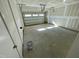 Spacious two car garage with overhead door, prepped electrical, and unfinished drywall at 1200 Alston Landing Way # 05, Cary, NC 27519