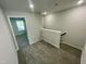 Upstairs hallway featuring carpet flooring and access to all the bedrooms at 1200 Alston Landing Way # 05, Cary, NC 27519