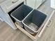 Kitchen cabinet with pull-out double trash cans for easy organization and convenience at 1200 Alston Landing Way # 05, Cary, NC 27519