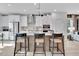 Open concept kitchen with large island, pendant lights, and stainless steel appliances at 1200 Alston Landing Way # 05, Cary, NC 27519