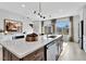 Gourmet kitchen island with undermount sink and stainless steel dishwasher, with an eating area nearby at 1200 Alston Landing Way # 05, Cary, NC 27519