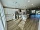 Open-concept kitchen boasts stainless steel appliances, white cabinetry, and center island with pendant lighting at 1200 Alston Landing Way # 05, Cary, NC 27519