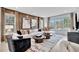 Bright living room with a large sofa, stylish rug, modern coffee tables, and decorative wall art at 1200 Alston Landing Way # 05, Cary, NC 27519