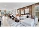 Open-concept living room with stylish decor, a large sectional sofa, and plenty of natural light at 1200 Alston Landing Way # 05, Cary, NC 27519