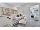 Bright office nook with a plush white chair, modern desk, and neutral walls at 1200 Alston Landing Way # 05, Cary, NC 27519