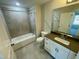 Full bathroom featuring neutral tiles, a shower-tub combo, and a modern vanity with ample storage at 1202 Alston Landing Way # 06, Cary, NC 27519