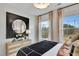 Bright bedroom boasts natural light, large windows, and tasteful furnishings at 1202 Alston Landing Way # 06, Cary, NC 27519